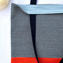 Load image into Gallery viewer, One of a kind bag. Tote Bag. Navy blue and white stripe cotton denim with an organic orange cotton denim bottom.
