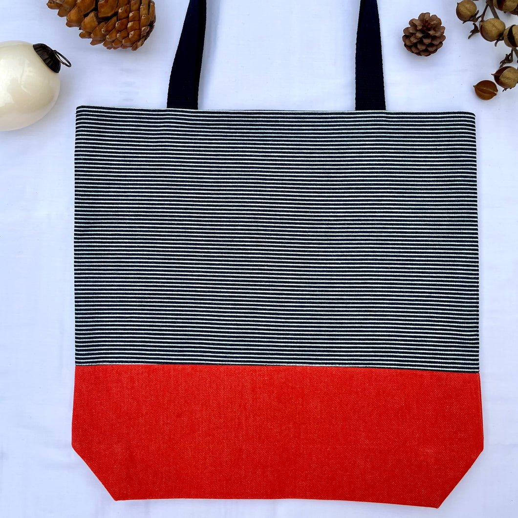 One of a kind bag. Tote Bag. Navy blue and white stripe cotton denim with an organic orange cotton denim bottom.