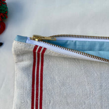 Load image into Gallery viewer, Red striped linen fabric and indigo blue denim fabric pouch. 2-fabric pouch. Zippered purse. Zippered pouch. YKK metal zipper.
