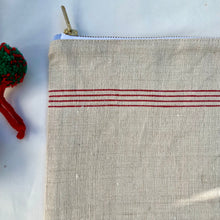 Load image into Gallery viewer, Red striped French linen and upcycled deep olive green leather. 2-material pouch with YKK zip. Zippered purse. Zippered pouch.
