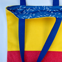 Load image into Gallery viewer, Tote bag. Vibrant yellow and red cotton canvas tote bag. Lined with a royal blue pattern cotton fabric.
