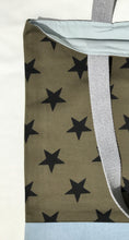 Load image into Gallery viewer, Tote bag. Khaki green twill cotton canvas with big black stars, fabric by a famous Italian designer house. Light blue cotton denim bottom.
