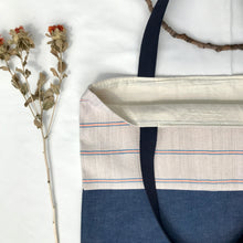Load image into Gallery viewer, Tote bag. Vintage Hmong hemp fabric from Thailand with neon pink and blue denim stripes and a blue denim bottom.
