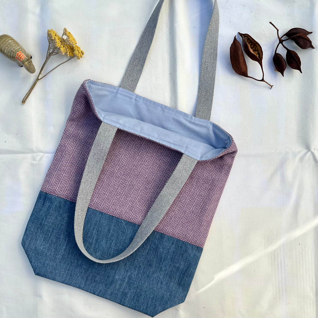 Tote bag. Pale mauve Herringbone pattern wool with a blue cotton denim bottom.