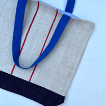Load image into Gallery viewer, Tote bag. Vintage grain sack tote bag. Handwoven. Vertical red stripes (linen). Dark blue denim.
