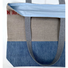Load image into Gallery viewer, Tote Bag. 100% French linen fabric « Bon appétit » with a light blue denim bottom.
