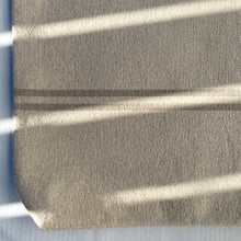 Load image into Gallery viewer, Tote bag. Heavyweight natural woven canvas with two horizontal sand-coloured stripes. Lined with a striped cotton shirting fabric.
