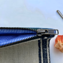 Load image into Gallery viewer, Vintage grain sack fabric and blue denim pouch. 2-fabric pouch with YKK zip. Zippered purse. Zippered pouch.
