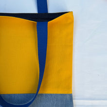 Load image into Gallery viewer, Tote bag. Canary yellow and blue denim cotton canvas tote bag. Lined with a midnight blue pattern cotton fabric.
